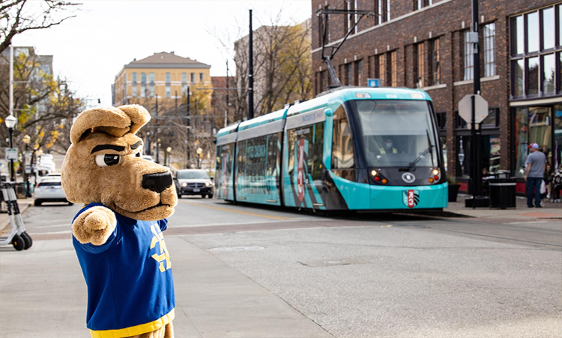 Kasey the Kangaroo poses in front of the KC Streetcar